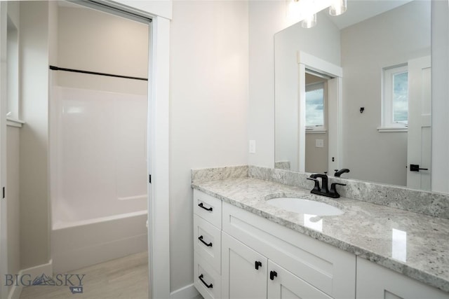 1610 Windrow Dr, Bozeman, MT 59718 - bathroom with vanity and washtub / shower combination