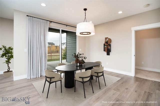 dining area featuring recessed lighting, light wood-style floors, and baseboards
