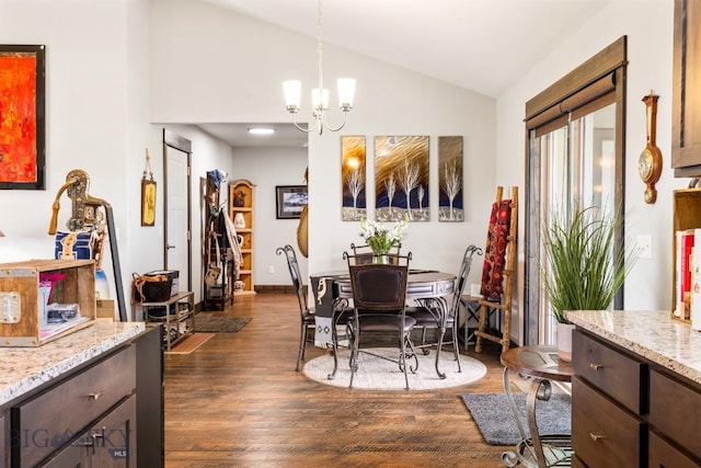 dining area featuring vaulted ceiling, an inviting chandelier, and dark wood finished floors