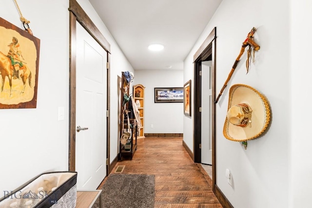 hallway featuring baseboards, visible vents, recessed lighting, and dark wood-type flooring