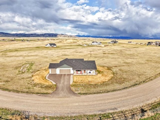bird's eye view with a mountain view and a rural view