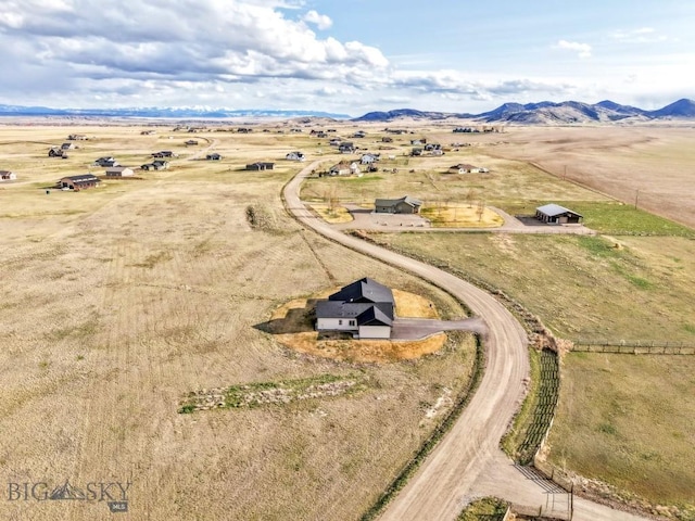 birds eye view of property with a rural view and a mountain view