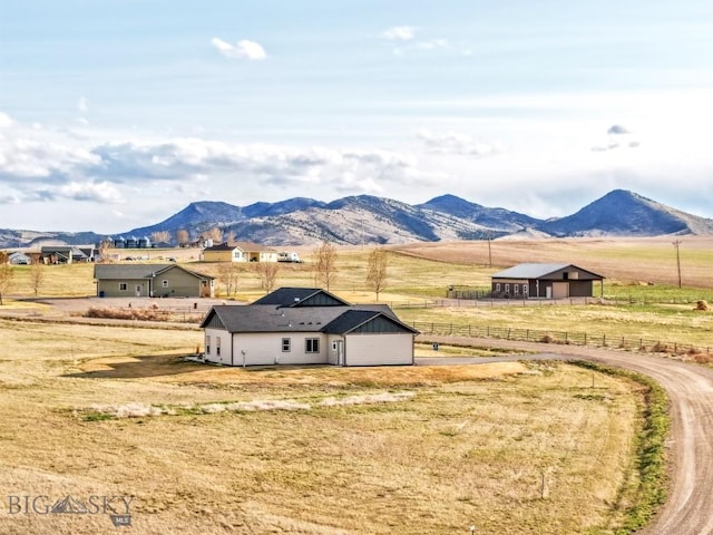 mountain view featuring a rural view