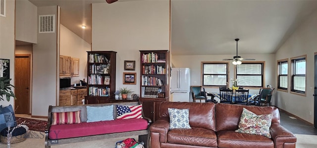 719 Jefferson St, Ennis, MT 59729 - carpeted living area with ceiling fan and high vaulted ceiling