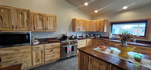 719 Jefferson St, Ennis, MT 59729 - kitchen with premium range, black microwave, lofted ceiling, recessed lighting, and dark tile patterned flooring