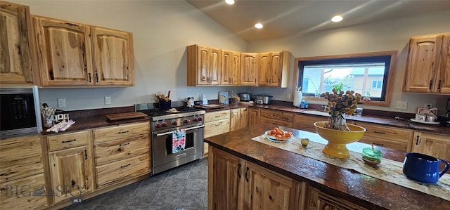 719 Jefferson St, Ennis, MT 59729 - kitchen with premium stove, black microwave, lofted ceiling, and recessed lighting