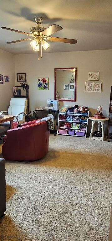 719 Jefferson St, Ennis, MT 59729 - living area featuring a ceiling fan and carpet flooring