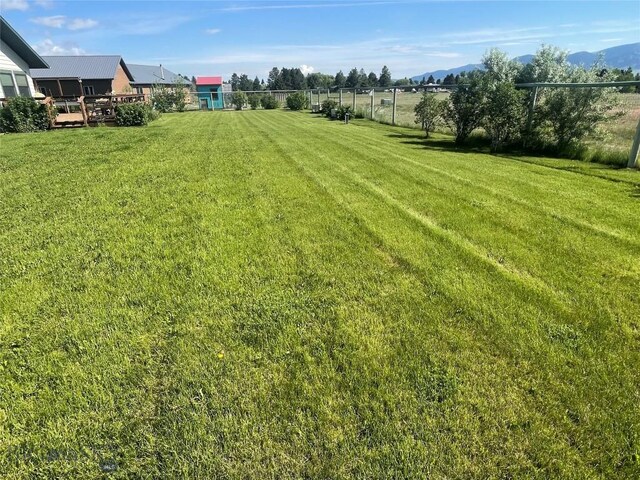 719 Jefferson St, Ennis, MT 59729 - view of yard with a mountain view