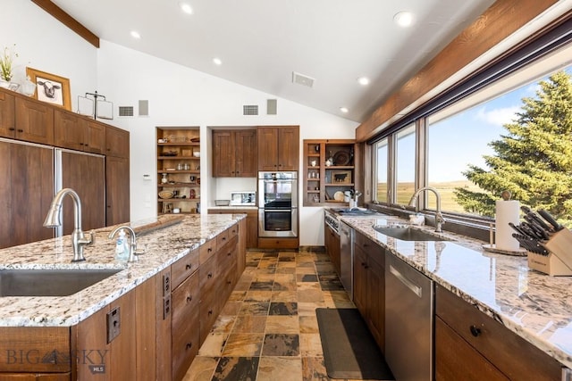 kitchen with open shelves, stainless steel appliances, and a sink
