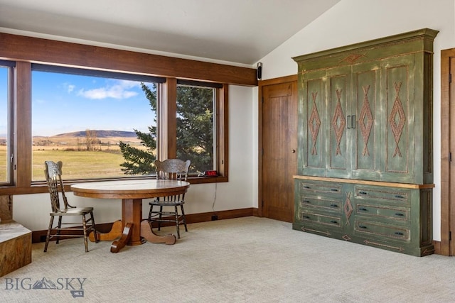 sitting room featuring lofted ceiling and carpet floors