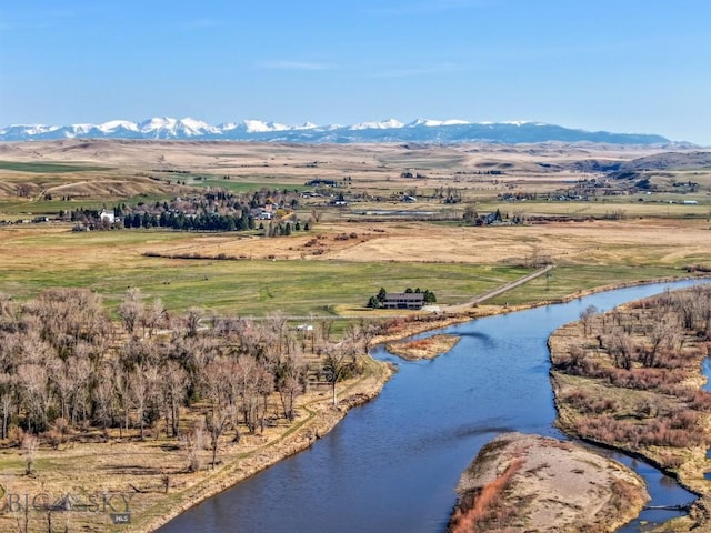 bird's eye view with a water and mountain view