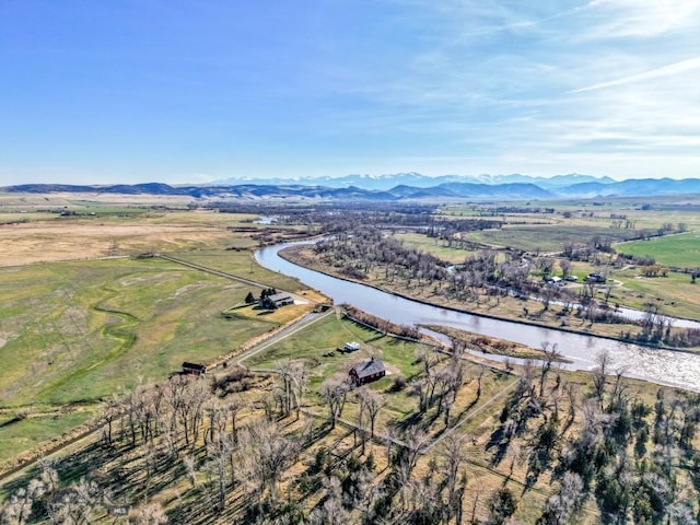aerial view featuring a rural view and a water and mountain view