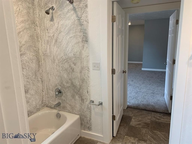 full bathroom featuring tub / shower combination and baseboards