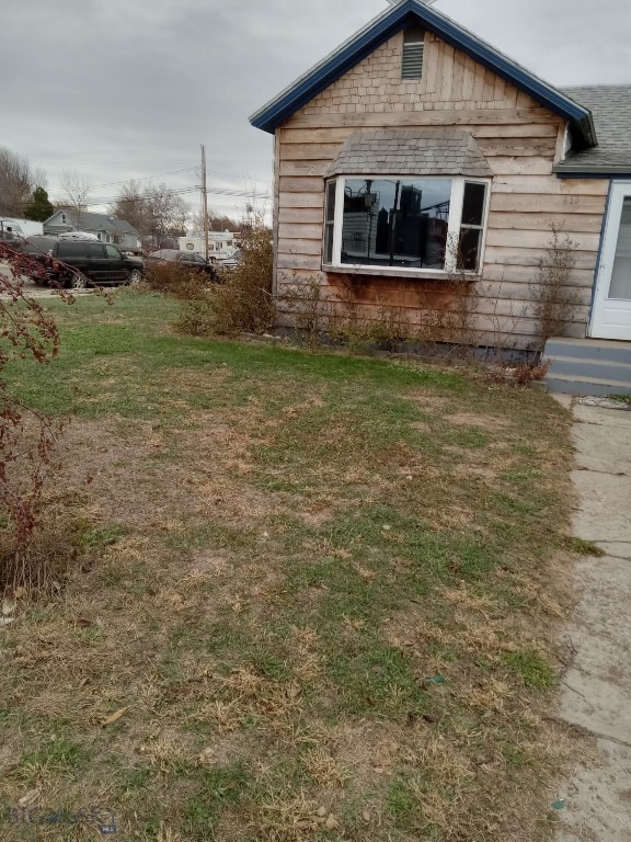 618 Washington St, Miles City, MT 59301 - view of property exterior with a lawn