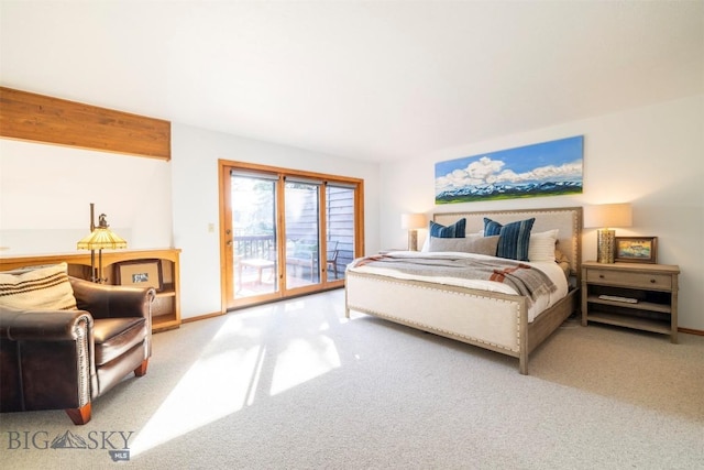carpeted bedroom with access to outside