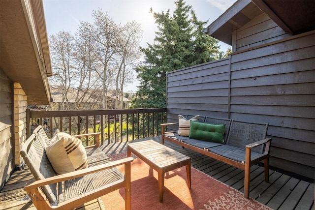 wooden terrace with outdoor lounge area