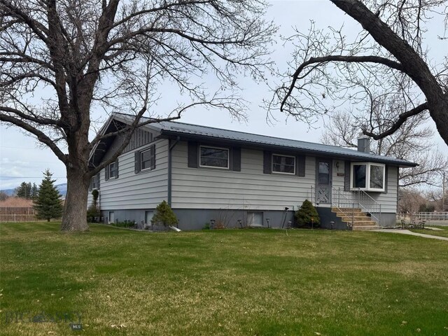 509 1st E, Whitehall, MT 59759 - view of front of home with a chimney and a front yard
