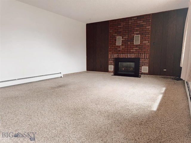 509 1st E, Whitehall, MT 59759 - unfurnished living room featuring a baseboard radiator, a brick fireplace, and wooden walls