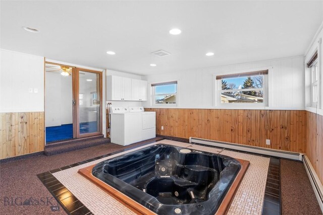 509 1st E, Whitehall, MT 59759 - misc room with washer and dryer, wooden walls, baseboard heating, a hot tub, and a wainscoted wall