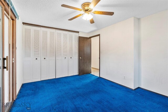 509 1st E, Whitehall, MT 59759 - unfurnished bedroom featuring carpet, a closet, ceiling fan, and a textured ceiling