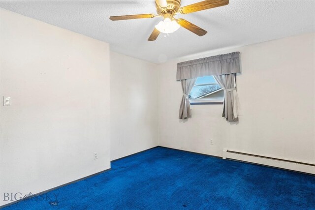 509 1st E, Whitehall, MT 59759 - spare room with carpet, a textured ceiling, baseboard heating, and a ceiling fan