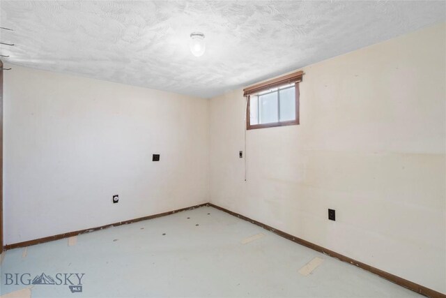 509 1st E, Whitehall, MT 59759 - basement featuring baseboards and a textured ceiling
