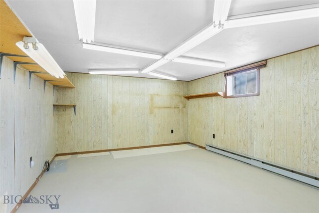 509 1st E, Whitehall, MT 59759 - below grade area with a baseboard heating unit and wooden walls