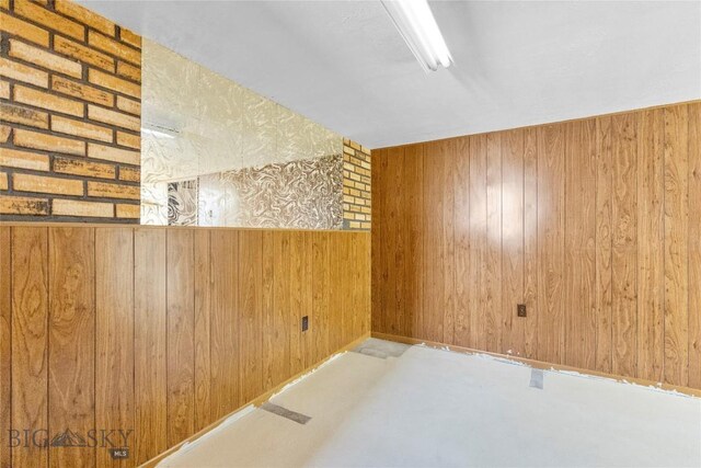 509 1st E, Whitehall, MT 59759 - spare room featuring wooden walls