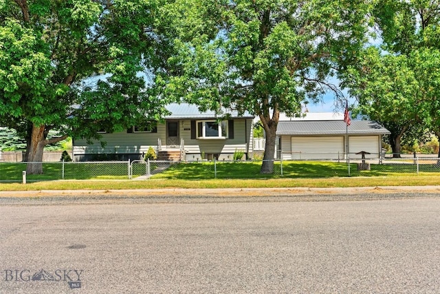 509 1st E, Whitehall, MT 59759 - view of front of property with a metal roof, a fenced front yard, and an attached garage
