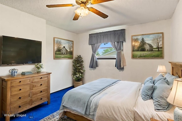509 1st E, Whitehall, MT 59759 - bedroom with a ceiling fan and dark carpet