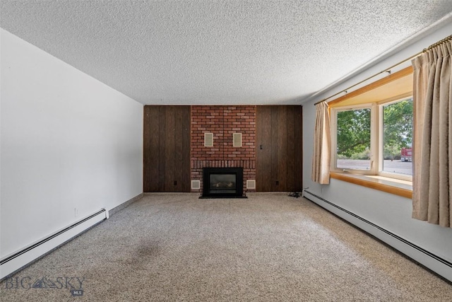 509 1st E, Whitehall, MT 59759 - unfurnished living room featuring a baseboard radiator, a textured ceiling, carpet, and a brick fireplace