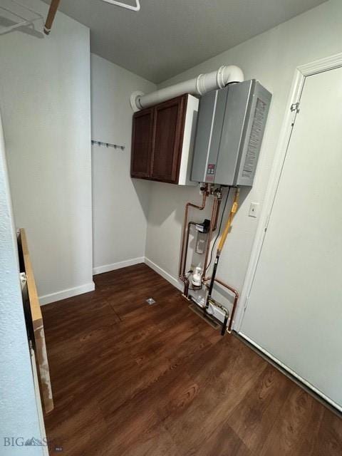 1421 Bluebird Ln, Bozeman, MT 59715 - laundry area with water heater and dark wood finished floors