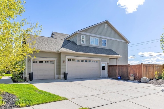 3609 Fieldstone W, Bozeman, MT 59715 - view of front of house with concrete driveway, a shingled roof, and a garage