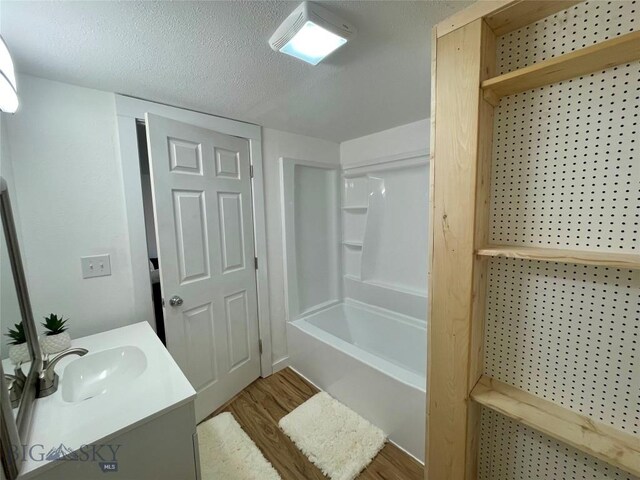 307 W Legion St, Whitehall, MT 59759 - full bathroom with shower / bath combination, wood finished floors, and vanity