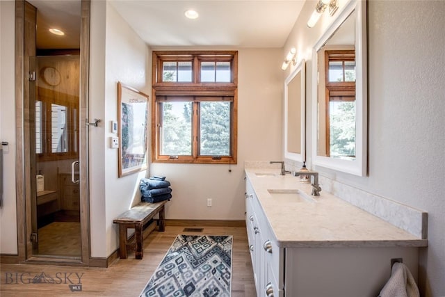 10 Wood Duck Rd, Ennis, MT 59729 - full bath with double vanity, wood finished floors, a shower stall, and recessed lighting