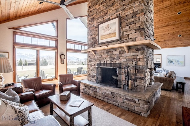 10 Wood Duck Rd, Ennis, MT 59729 - living area with wood ceiling, a stone fireplace, wood finished floors, and high vaulted ceiling
