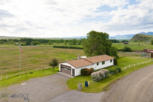 birds eye view of property with a rural view and a mountain view
