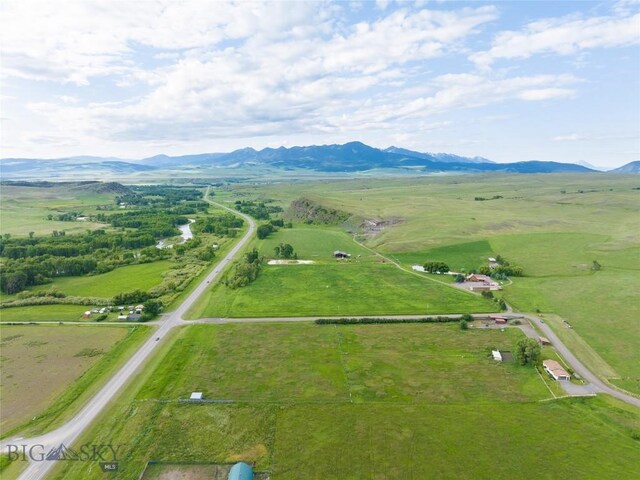 drone / aerial view featuring a mountain view and a rural view