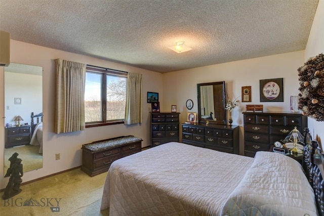 carpeted bedroom featuring a textured ceiling and baseboards