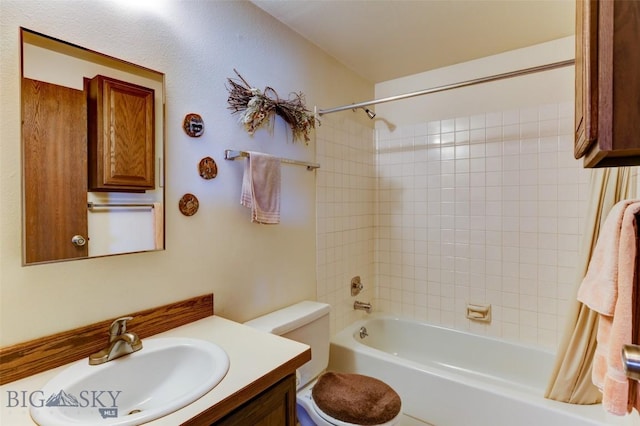 full bath featuring toilet, vanity, and shower / bathing tub combination