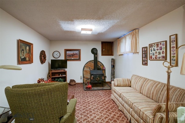 carpeted living room featuring a textured ceiling and a wood stove