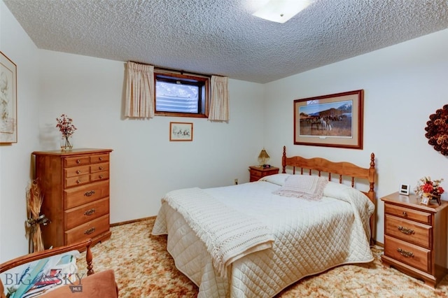 carpeted bedroom with a textured ceiling