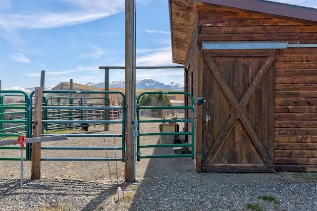 view of horse barn featuring a mountain view