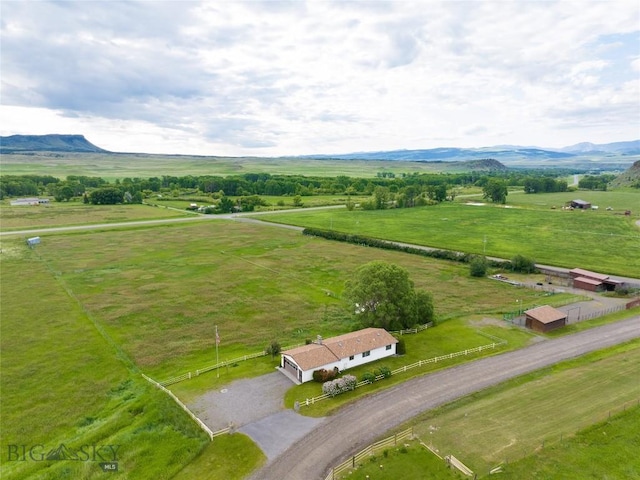 drone / aerial view with a mountain view and a rural view