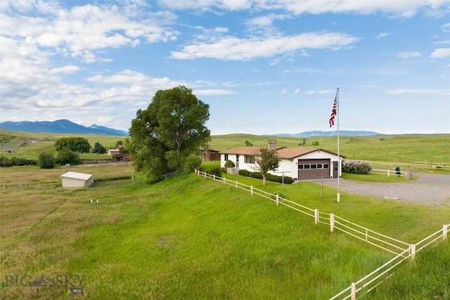 exterior space with a rural view and a mountain view