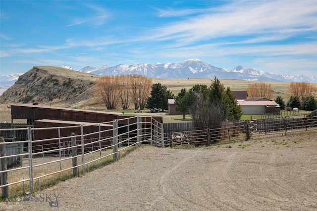 mountain view featuring a rural view