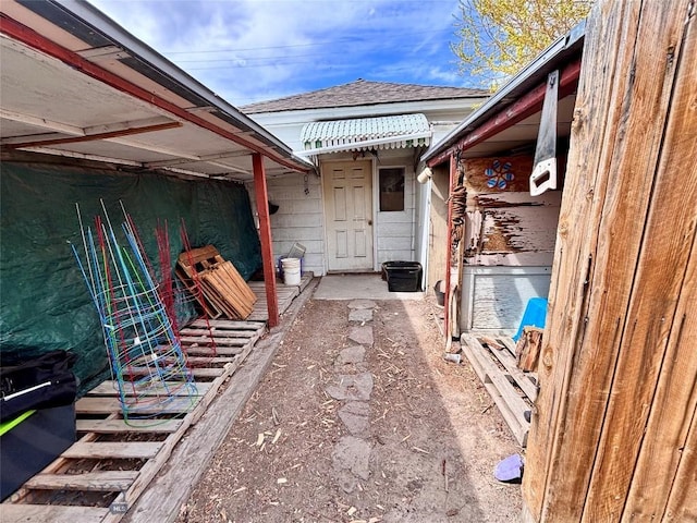 113 N Pacific St, Dillon, MT 59725 - view of exterior entry with a shingled roof