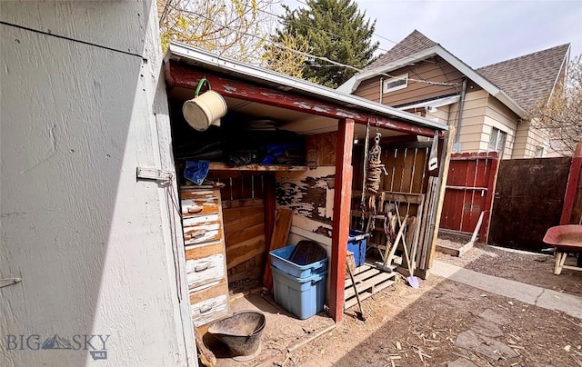 view of outbuilding with fence