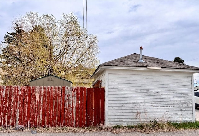 113 N Pacific St, Dillon, MT 59725 - view of home's exterior featuring roof with shingles