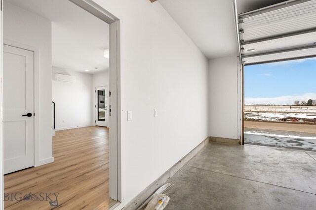 garage featuring an AC wall unit